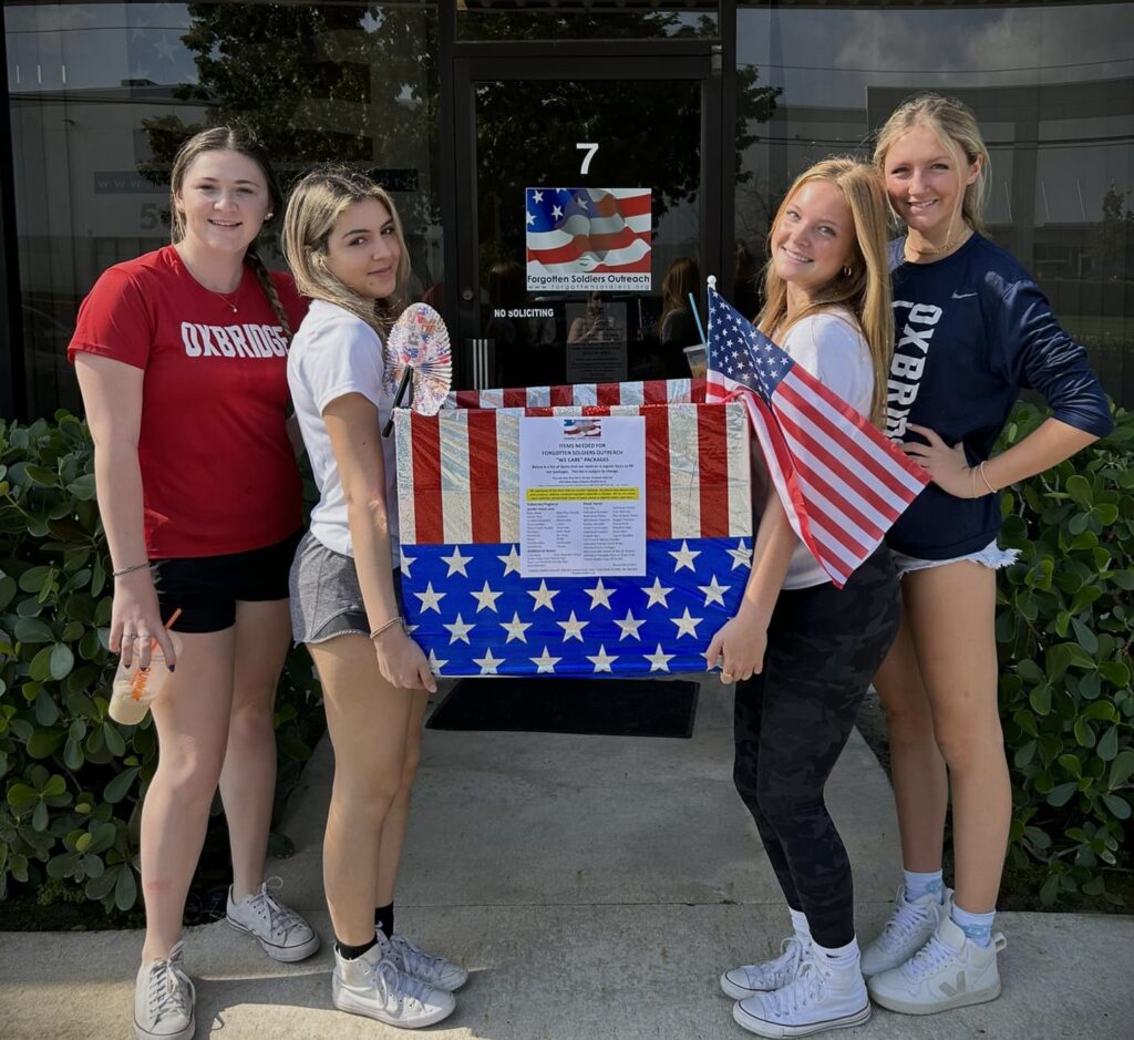 Student leaders organizing donated care package items to support U.S. service members serving overseas through the FSO Student Ambassador Program.