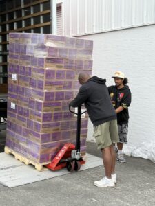 Volunteers move 2,000 cases of Girl Scout cookies