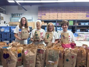 care package items for deployed troops being prepared by volunteers